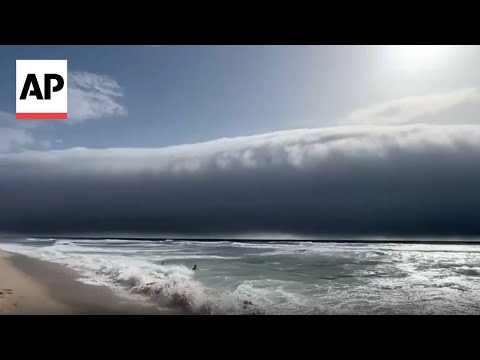 YouTube video thumbnail: Rare Cloud Amazes Beachgoers in Portugal