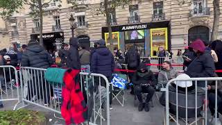 Heightened Security Outside Store as Watch Collab Brings Hundreds to Champs Elysees