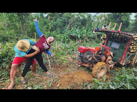 girl driving agricultural vehicle transporting wood
