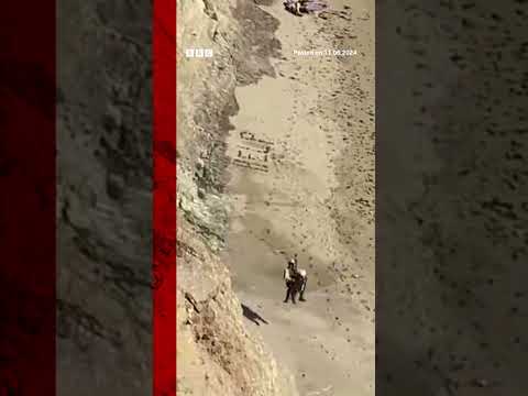 A kite surfer was airlifted to safety after writing 'HELP' in the sand. #Kitesurfing #BBCNews