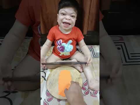 cute baby making roti chappati..