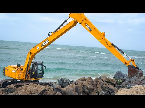 JCB 245 HDLR and Kumatsu 210 Tata 140 Excavator Stones Being Laid to prevent Soil erosion on Beach