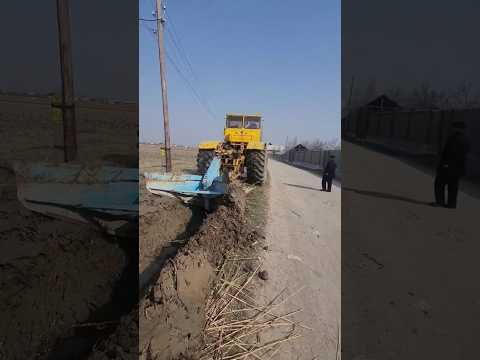 GIANT TRACTOR OPENS GIANT WATER CHANNEL