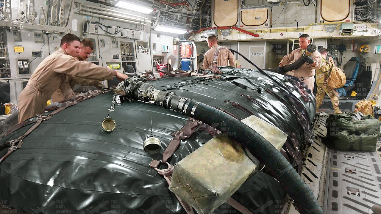 US Airmen Securing Massive Jet Fuel Bladders Inside US C-17 Aircraft