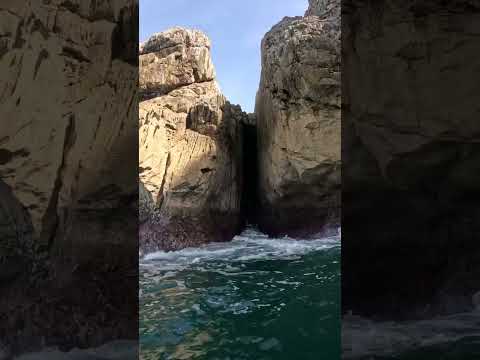 Paddle Surfer Escapes Narrow Ocean Crevice