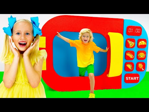 Kids play with toy microwave
