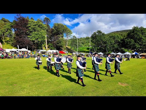 The Vale of Atholl Pipe Band playing Wings on march during 2024 Kenmore Highland Games in Scotland