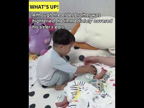 Thunder awakens two children, prompting the older brother to quickly comfort his sister.