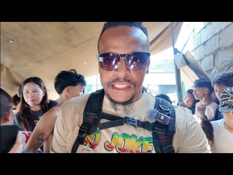 Colaz Smith tv feeds the people under the bridge in the Philippines from Jamaica