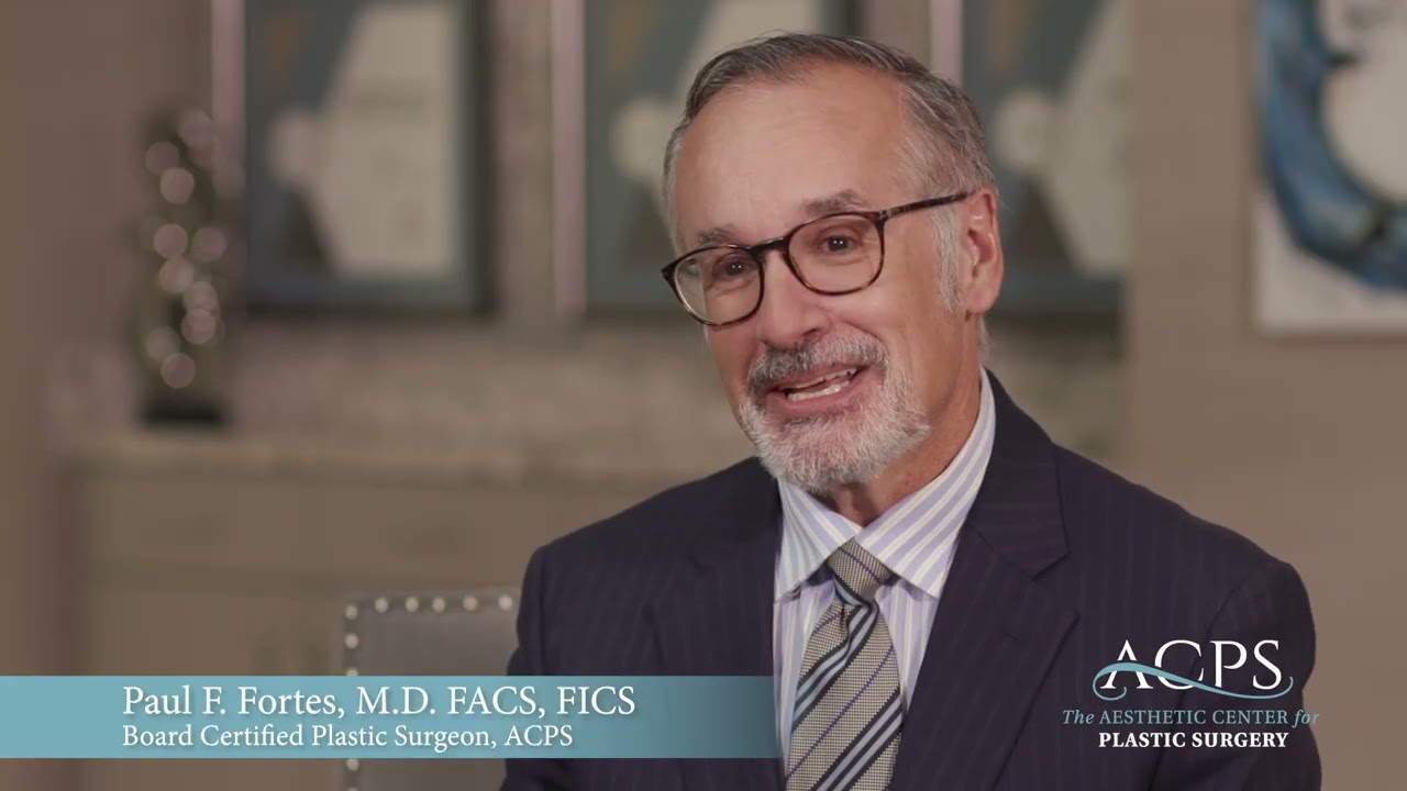 Smiling plastic surgeon sharing expertise in aesthetics.
