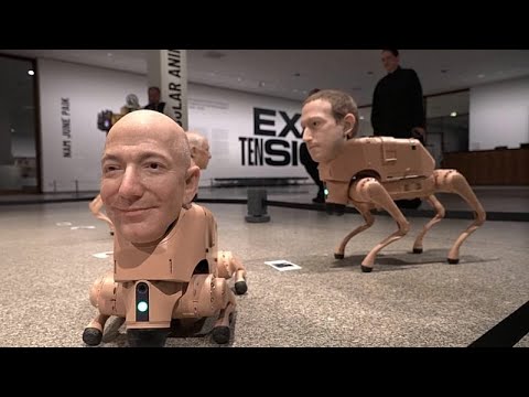 YouTube video thumbnail: Robot Dogs With Elon Musk and Bezos' Faces Are Excreting AI Art at a Berlin Museum