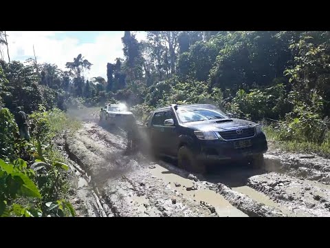 Toyota Hilux and Mitsubishi Strada Triton In Mud Track - 4x4 Pickup Truck In Mud Route