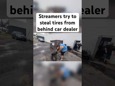 Streamers try to steal tires from behind car dealer
