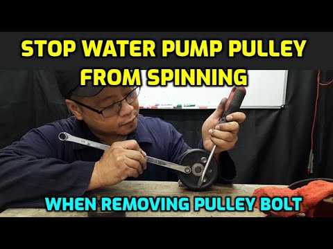 WATER PUMP PULLEY KEEPS SPINNING WHEN TRYING TO REMOVE PULLEY BOLT DURING WATER PUMP REPLACEMENT