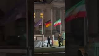 Iran Protest.  Raising the lion and sun flag of Iran in front of the German parliament.