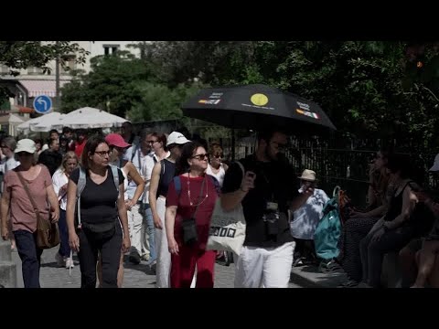 YouTube video thumbnail: Tourists Cool off by Paris Fountains in France's Heatwave