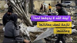 عائلة سورية تبحث تحت عن أغراضها تحت خيمتها الغارقة