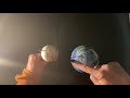Exploring the Dark Side of the Moon: Rotation and Revolution