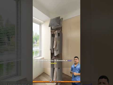 Habitaci贸n en la que se ubica la cama en la esquina para ganar espacio e incluir estos elementos