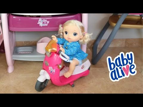 BABY ALIVE BRASIL- BABY ALIVE NINA SE DIVERTINDO NA ROTINA COM A MOTO DE BRINQUEDO