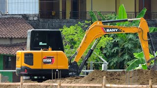 SANY SY55U Excavators work to level the land to build a house
