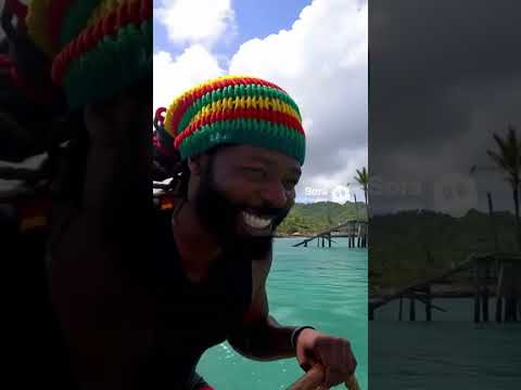 Jamaican man riding around on a dunkleosteus after Hurricane