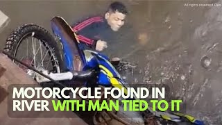 MOTORCYCLE FOUND IN RIVER WITH MAN TIED TO IT