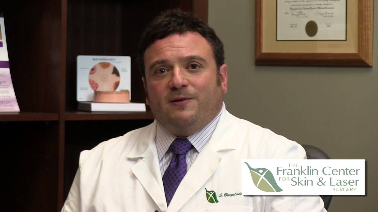 Doctor discussing skin and laser surgery options.