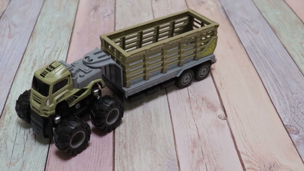 Тягач Lanson Toys с динозавром в прицепе инерционный металлический с 3лет - видео