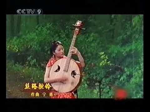 Chinese guitarist plays eastern instrumental.