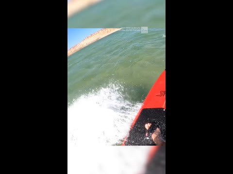Stingray soars through the air, nearly hits surfer