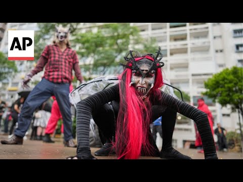 YouTube video thumbnail: Hundreds March Through São Paulo for Annual Zombie Walk