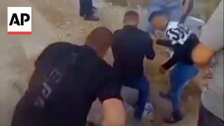 YouTube video thumbnail: Israeli Settlers Force Palestinian Man to Dig up His Father's Grave and Rebury Him