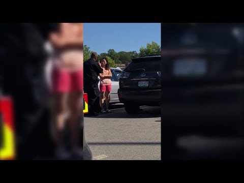 Police officer filmed yelling at mother for leaving children in hot car