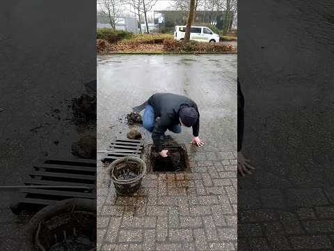 S#058-2  Unclogging a storm drain during rain in Germany, #shorts