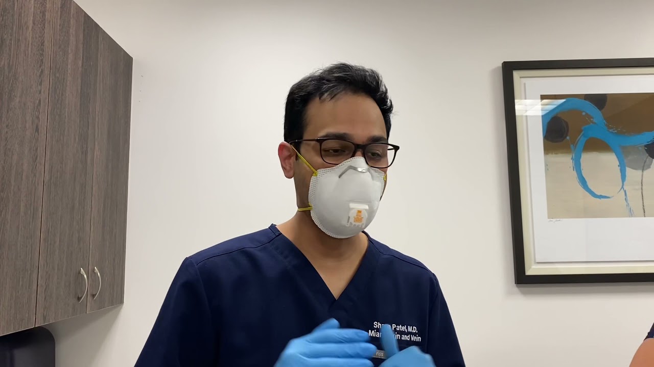 Woman with markings for cosmetic procedure preparation.