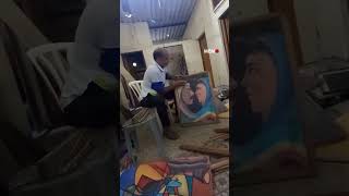 Artist Taha Husien breaks his own paintings for firewood to cook food for his children in Gaza