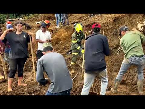 YouTube video thumbnail: Colombians dig Through Landslide Debris for Survivors 