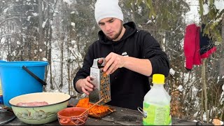 A guy cooks the most delicious potatoes with meat and shashlik in the winter outdoors