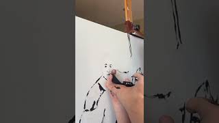 Painting Brianne Jenner with hockey equipment and golf club as a paintbrush.