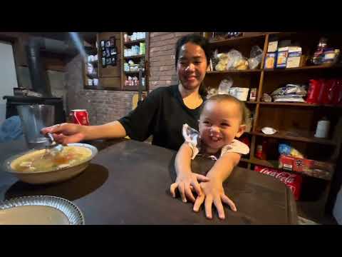 Everly tells a story before we eat Reche’s pork soup - 🇵🇭 🇺🇸