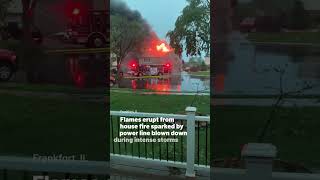 Flames erupt from house fire sparked by power line blown down during intense storms