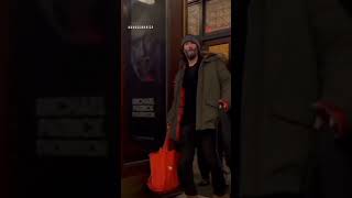 Keanu Reeves’ Friendly Vibe -  Smiles and Waves”