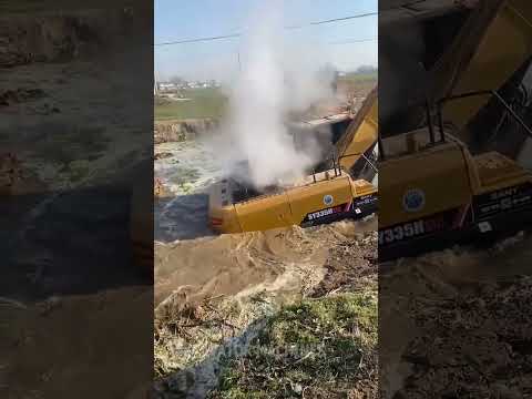 He tries to get the excavator out of the mud