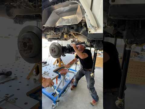 Getting the rear axle and suspension installed in the Gladiator