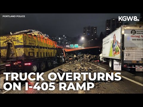 Trash truck overturns on I-405 in Portland, debris lands on road below