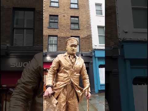 How gold man statue is getting into his position (beats by Silverman Statue )