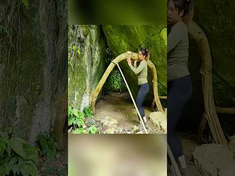 Single girl makes a safe shelter under a big rock #survival #camping #outdoors #survivalskills