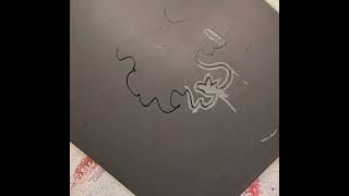 carving a delicate, lacy edge on a lino block.