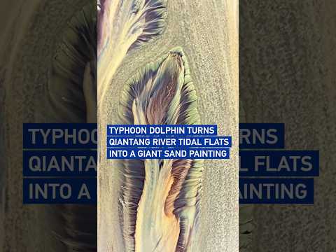 Typhoon Dolphin turns Qiantang River tidal flats into a giant sand painting